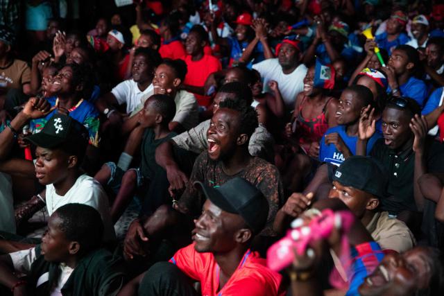 Haiti fans react while watching the 2026 World Cup match between Brazil and Haiti in Port-au-Prince, Haiti, on June 19, 2026. (Photo by Clarens SIFFROY / AFP)