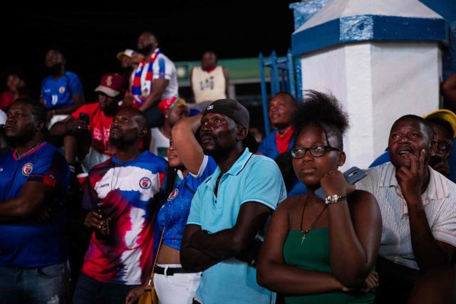 Haiti fans react while watching the 2026 World Cup match between Brazil and Haiti in Port-au-Prince, Haiti, on June 19, 2026. (Photo by Clarens SIFFROY / AFP)