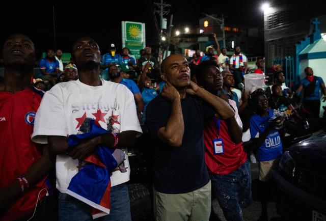 Haiti fans react while watching the 2026 World Cup match between Brazil and Haiti in Port-au-Prince, Haiti, on June 19, 2026. (Photo by Clarens SIFFROY / AFP)