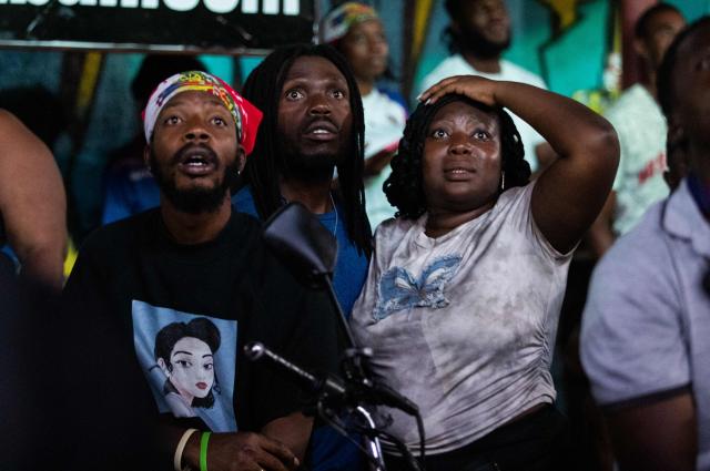 Haiti fans react while watching the 2026 World Cup match between Brazil and Haiti in Port-au-Prince, Haiti, on June 19, 2026. (Photo by Clarens SIFFROY / AFP)