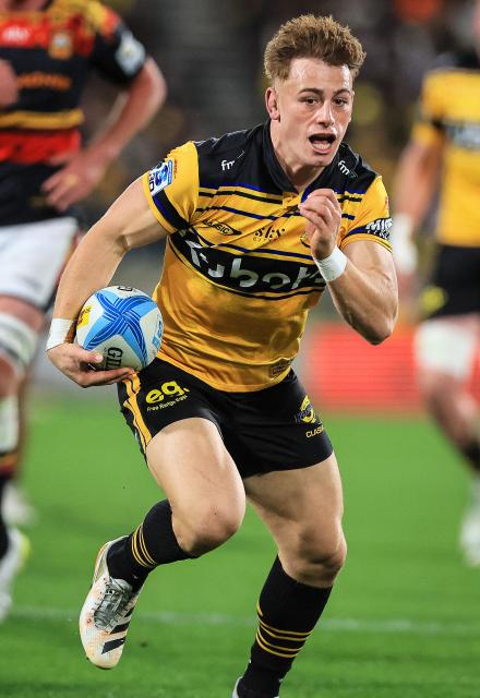 Hurricanes Ruben Love runs the ball during the Super Rugby Pacific final match between the Wellington Hurricanes and Waikato Chiefs in Wellington on June 20, 2026. (Photo by Grant Down / AFP)