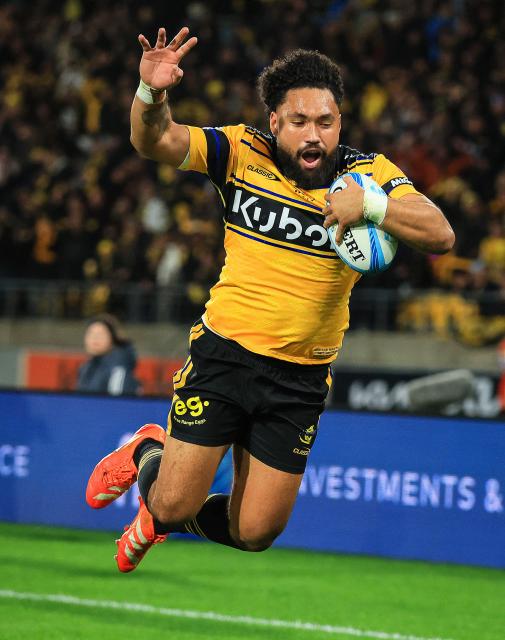 Hurricanes Fehi Fineanganofo dives in to score a try during the Super Rugby Pacific final match between the Wellington Hurricanes and Waikato Chiefs in Wellington on June 20, 2026. (Photo by Grant Down / AFP)