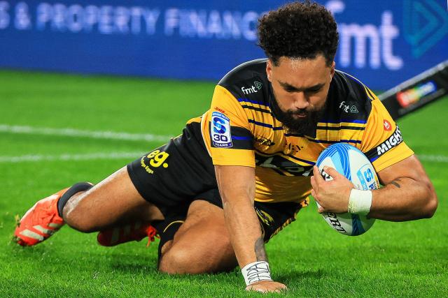 Hurricanes Fehi Fineanganofo scores a try during the Super Rugby Pacific final match between the Wellington Hurricanes and Waikato Chiefs in Wellington on June 20, 2026. (Photo by Grant Down / AFP)