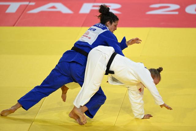Miriam Butkereit of Germany (blue) competes with Aoife Coughlan of Australia (white) in their semi-final for women under 70kg at the Judo Ulaanbaatar Grand Slam 2026 in Ulaanbaatar on June 20, 2026. (Photo by ADEK BERRY / AFP)