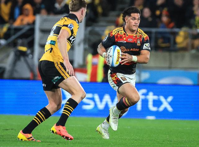 Chiefs Quinn Tupaea looks to make a pass during the Super Rugby Pacific final match between the Wellington Hurricanes and Waikato Chiefs in Wellington on June 20, 2026. (Photo by Grant Down / AFP)