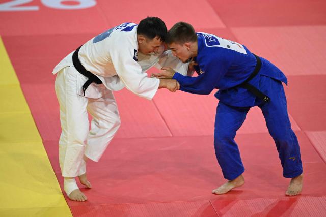 Jack Yonezuka of USA (blue) competes with Uranbayar Odgerel of Mongolia (white) in their semi-final for men under 73kg at the Judo Ulaanbaatar Grand Slam 2026 in Ulaanbaatar on June 20, 2026. (Photo by ADEK BERRY / AFP)