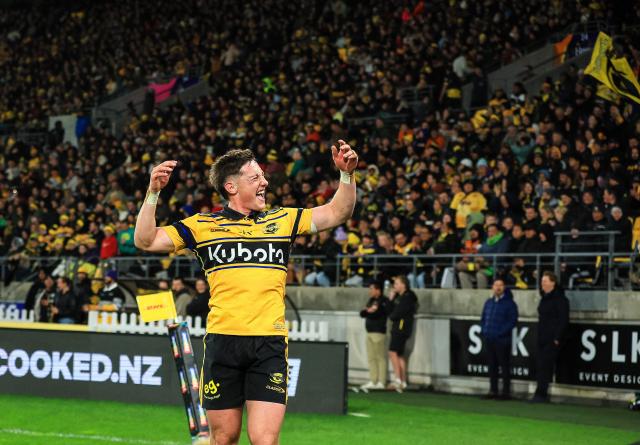 Hurricanes Cam Roigard fires up the crowd during the Super Rugby Pacific final match between the Wellington Hurricanes and Waikato Chiefs in Wellington on June 20, 2026. (Photo by Grant Down / AFP)