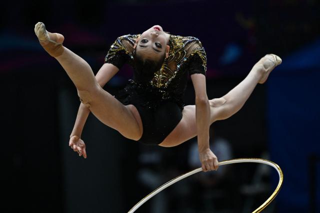 China's Wang Qi competes in the individual hoop of the 2026 Rhythmic Gymnastics World Challenge Cup in Beijing on June 20, 2026. (Photo by Pedro PARDO / AFP)
