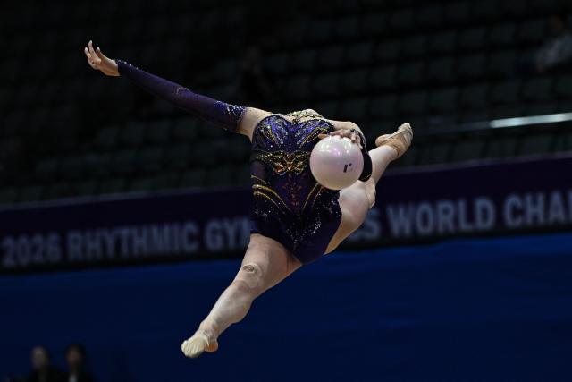 China's Wang Qi competes in the individual ball of the 2026 Rhythmic Gymnastics World Challenge Cup in Beijing on June 20, 2026. (Photo by Pedro PARDO / AFP)