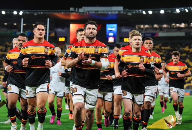 Chiefs' Simon Parker leads his team to the changing sheds  during the Super Rugby Pacific final match between the Wellington Hurricanes and Waikato Chiefs in Wellington on June 20, 2026. (Photo by Grant Down / AFP)