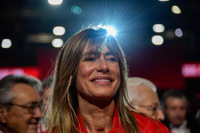 (FILES) Begona Gomez, wife of Spain's prime minister Pedro Sanchez, attends the 41st congress of the Spanish Socialist Workers Party (PSOE) at the Palacio de Exposiciones in Seville, on December 1, 2024. A Spanish court has ordered the wife of Prime Minister Pedro Sanchez, Begona Gomez, to stand trial for corruption and banned her from leaving the country, according to a court order released on June 20, 2026. Judge Juan Carlos Peinado ordered Gomez to hand in her passport and to check in with the authorities twice a month until a verdict is reached in the case, the ruling said. (Photo by CRISTINA QUICLER / AFP)