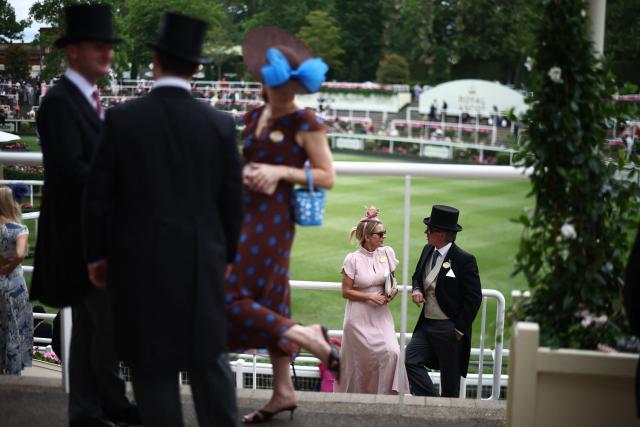 Racegoers mingle ahead of racing on the fifth day of the Royal Ascot horse racing meeting in Ascot, west of London, on June 20, 2026. (Photo by Henry Nicholls / AFP)