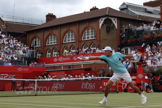 US player Brandon Nakashima returns to Argentina's Francisco Cerundolo during their men's singles semi-final tennis match on day six of the ATP HSBC Championships at Queen's Club in west London on June 20, 2026. (Photo by Adrian DENNIS / AFP)