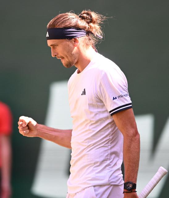 Germany's Alexander Zverev reacts during his men's singles semi-final match against Taylor Fritz of the US of the Halle Open ATP tennis tournament in Halle, western Germany, on June 20, 2026. (Photo by CARMEN JASPERSEN / AFP)