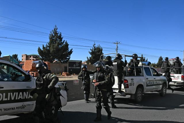 Police officers are deployed in El Alto, Bolivia on June 20, 2026, after Bolivian president Rodrigo Paz declared state of emergency. Bolivian President Rodrigo Paz declared a state of emergency across the Latin American country after more than six weeks of road blockades and protests demanding his resignation, saying he had exhausted "all avenues of dialogue." (Photo by AIZAR RALDES / AFP)