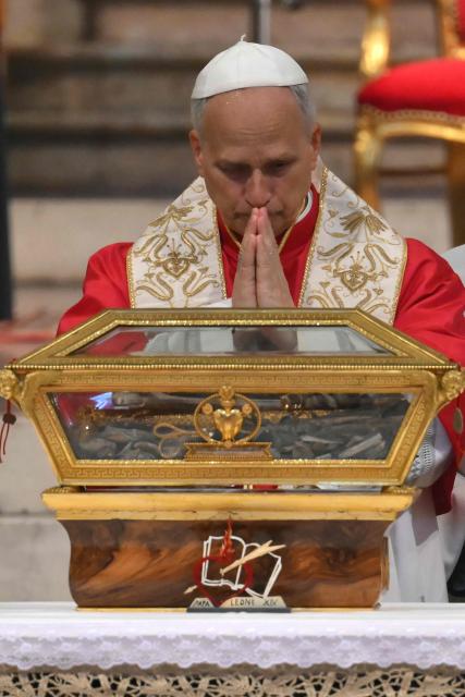 Pope Leo XIV is pictured during the veneration of the Relics of St Augustine at the Augustinian Basilica of St. Peter in the Golden Sky (Basilica di San Pietro in Ciel d’Oro) as part of a pastoral visit in Pavia on June 20, 2026. (Photo by Marco BERTORELLO / AFP)