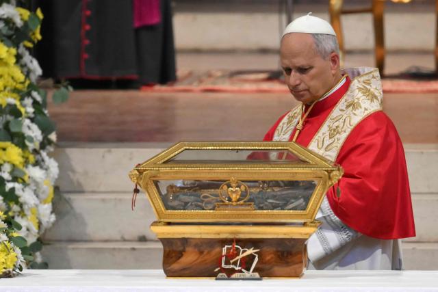 Pope Leo XIV is pictured during the veneration of the Relics of St Augustine at the Augustinian Basilica of St. Peter in the Golden Sky (Basilica di San Pietro in Ciel d’Oro) as part of a pastoral visit in Pavia on June 20, 2026. (Photo by Marco BERTORELLO / AFP)