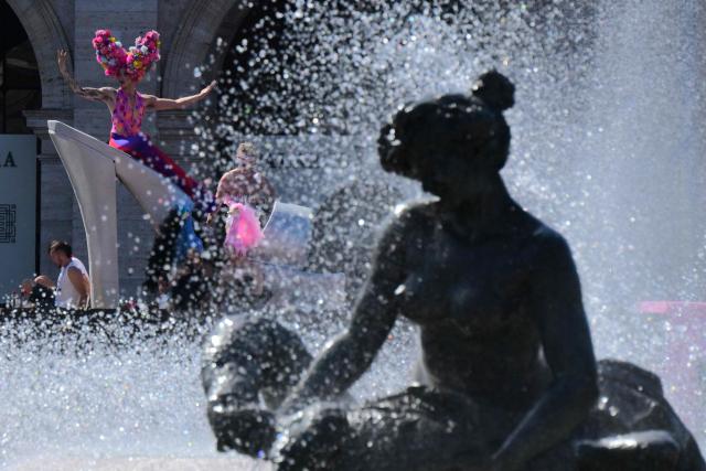 People gather at Piazza della Repubblica during the Pride March in Rome on June 20, 2026. (Photo by Tiziana FABI / AFP)