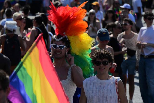 People gather at Piazza della Repubblica during the Pride March in Rome on June 20, 2026. (Photo by Tiziana FABI / AFP)