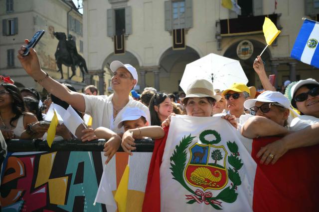 People wait for the arrival of Pope Leo XIV during a pastoral visit in Pavia on June 20, 2026. (Photo by Marco BERTORELLO / AFP)