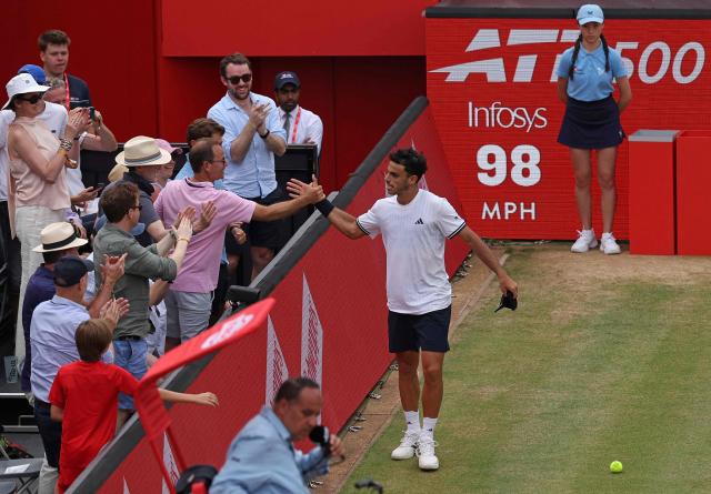 Argentina's Francisco Cerundolo celebrates winning against US player Brandon Nakashima during their men's singles semi-final tennis match on day six of the ATP HSBC Championships at Queen's Club in west London on June 20, 2026. Cerundolo won the match 6-7, 6-3, 6-4. (Photo by Adrian Dennis / AFP)