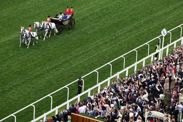 Britain's King Charles III and Britain's Queen Camilla arrive by horse-drawn carriage on the fifth day of the Royal Ascot horse racing meeting in Ascot, west of London, on June 20, 2026. (Photo by Henry Nicholls / AFP)
