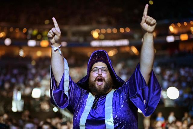 A supporter cheers during the semi-final of the IEM Cologne Major 2026 Counter Strike tournament at the Lanxess Arena in Cologne, western Germany ob June 20, 2026. (Photo by Ina FASSBENDER / AFP)
