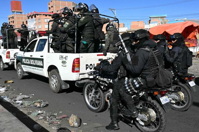 Police officers are deployed at a blockade zone in Cruce Ventilla, El Alto, Bolivia on June 20, 2026, after Bolivian president Rodrigo Paz declared state of emergency. Bolivian President Rodrigo Paz declared a state of emergency across the Latin American country after more than six weeks of road blockades and protests demanding his resignation, saying he had exhausted "all avenues of dialogue." (Photo by AIZAR RALDES / AFP)