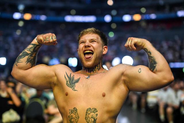 A supporter shows his muscles during the semi-final of the IEM Cologne Major 2026 Counter Strike tournament at the Lanxess Arena in Cologne, western Germany ob June 20, 2026. (Photo by Ina FASSBENDER / AFP)