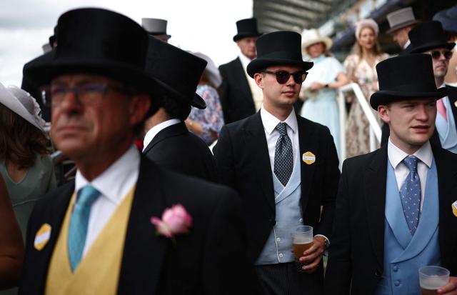 Racegoers attend the fifth day of the Royal Ascot horse racing meeting in Ascot, west of London, on June 20, 2026. (Photo by Henry NICHOLLS / AFP)