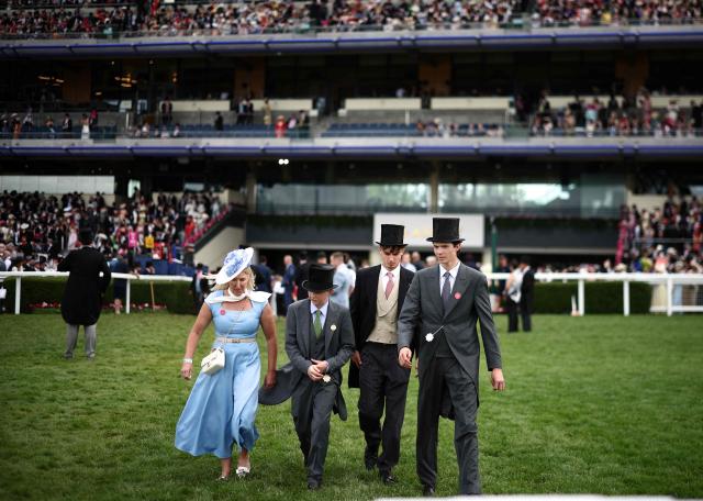 Racegoers crouse the course on the fifth day of the Royal Ascot horse racing meeting in Ascot, west of London, on June 20, 2026. (Photo by Henry Nicholls / AFP)