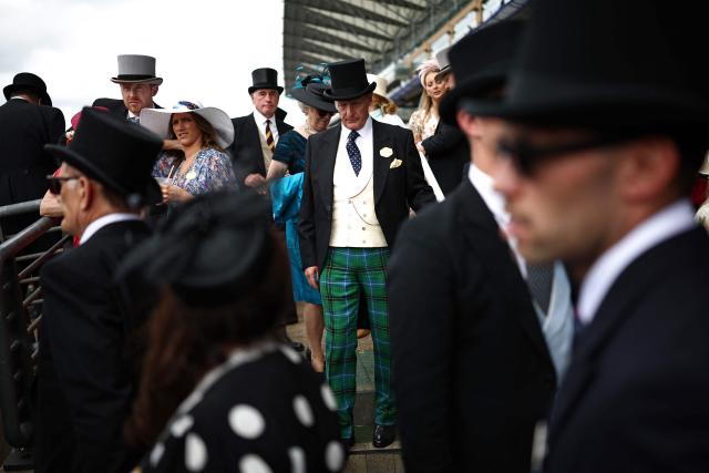 Racegoers attend the fifth day of the Royal Ascot horse racing meeting in Ascot, west of London, on June 20, 2026. (Photo by Henry Nicholls / AFP)