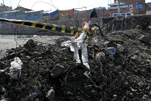 View of a barricade at a blockade zone in Cruce Ventilla in El Alto, Bolivia on June 20, 2026, after Bolivian president Rodrigo Paz declared state of emergency. Bolivian President Rodrigo Paz declared a state of emergency across the Latin American country after more than six weeks of road blockades and protests demanding his resignation, saying he had exhausted "all avenues of dialogue." (Photo by AIZAR RALDES / AFP)