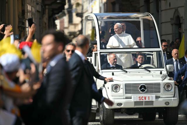Pope Leo XIV arrives at Piazza Duomo during a pastoral visit in Pavia on June 20, 2026. (Photo by Marco BERTORELLO / AFP)