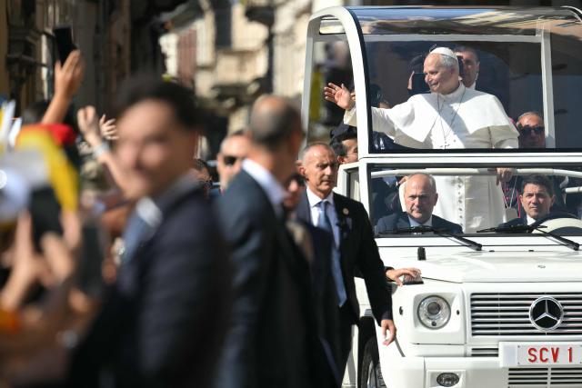 Pope Leo XIV arrives at Piazza Duomo during a pastoral visit in Pavia on June 20, 2026. (Photo by Marco BERTORELLO / AFP)