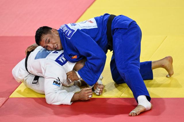 Ankhzaya Lavjargal (R) of Mongolia and Jack Yonezuka of USA compete during the men's under 73kg final event at the Judo Ulaanbaatar Grand Slam 2026 in Ulaanbaatar, Mongolia on June 20, 2026. (Photo by ADEK BERRY / AFP)