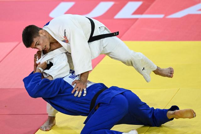 Jack Yonezuka (top) of USA and Ankhzaya Lavjargal of Mongolia compete during the men's under 73kg final event at the Judo Ulaanbaatar Grand Slam 2026 in Ulaanbaatar, Mongolia on June 20, 2026. (Photo by ADEK BERRY / AFP)