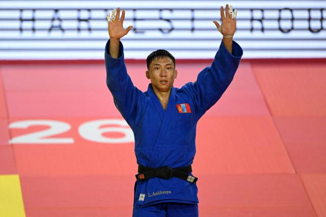 Ankhzaya Lavjargal of Mongolia celebrates after winning the men's under 73kg final event against Jack Yonezuka of USA during the Judo Ulaanbaatar Grand Slam 2026 in Ulaanbaatar, Mongolia on June 20, 2026. (Photo by ADEK BERRY / AFP)