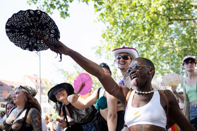 An attendee dances while taking part in the annual Gay Pride parade, known in French as « La Marche des Fiertés LGBT+ », in Strasbourg, eastern France on June 20, 2026. (Photo by ROMEO BOETZLE / AFP)