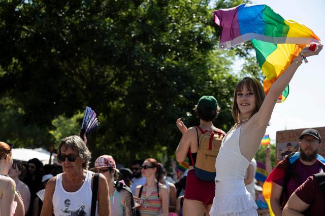 An attendee waves a LGBT+ flag while taking part in the annual Gay Pride parade, known in French as « La Marche des Fiertés LGBT+ », in Strasbourg, eastern France on June 20, 2026. (Photo by ROMEO BOETZLE / AFP)