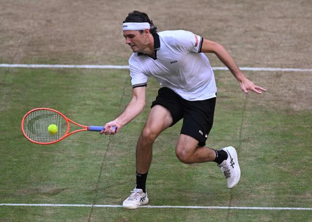 Taylor Fritz of the US returns the ball to Germany's Alexander Zverev during their men's singles semi-final match of the Halle Open ATP tennis tournament in Halle, western Germany, on June 20, 2026. (Photo by CARMEN JASPERSEN / AFP)