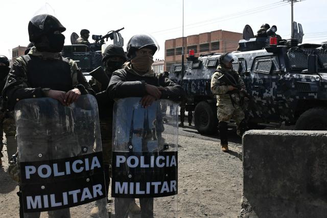 Military police are deployed at a blockade zone in Cruce Ventilla in El Alto, Bolivia on June 20, 2026, after Bolivian President Rodrigo Paz declared state of emergency. Bolivian President Rodrigo Paz declared a state of emergency across the Latin American country after more than six weeks of road blockades and protests demanding his resignation, saying he had exhausted "all avenues of dialogue." (Photo by AIZAR RALDES / AFP)