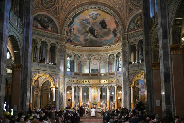 Pope Leo XIV listens to Maurizio Malvestiti, bishop of Lodi, at the Parish of Saints Anthony Abbot and Francesca Cabrini in Sant'Angelo Lodigiano during a pastoral visit in Pavia and Sant'Angelo Lodigiano, on June 20, 2026. (Photo by Marco BERTORELLO / AFP)