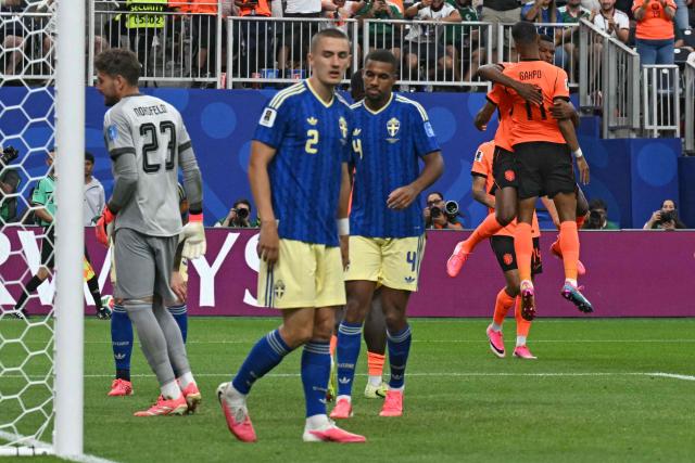 Netherlands' forward #11 Cody Gakpo (2ndR) celebrates after scoring a goal during the 2026 World Cup Group F football match between the Netherlands and Sweden at the Houston Stadium in Houston on June 20, 2026.  (Photo by RONALDO SCHEMIDT / AFP)