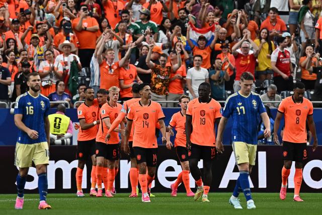 Netherlands' players celebrate their third goal during the 2026 World Cup Group F football match between the Netherlands and Sweden at the Houston Stadium in Houston on June 20, 2026.  (Photo by Paul ELLIS / AFP)