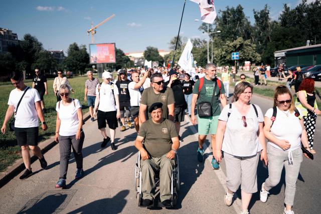 Large group of students and other citizens of Serbia gather during a protest in Novi Sad, on June 20, 2026. The student movement for political change and battle against corruption, organized the protest with aim of informing the citizens of their goals and future political plans. (Photo by UROS ARSIC / AFP)