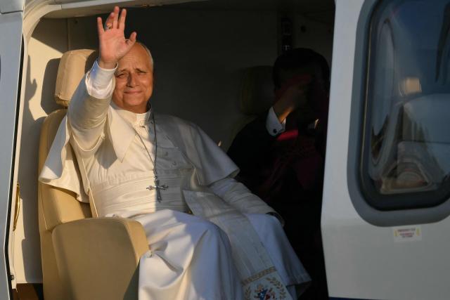 Pope Leo XIV waves before to take off from Sant'Angelo Lodigiano at the end of a pastoral visit in Pavia and Sant'Angelo Lodigiano, on June 20, 2026. (Photo by Marco BERTORELLO / AFP)