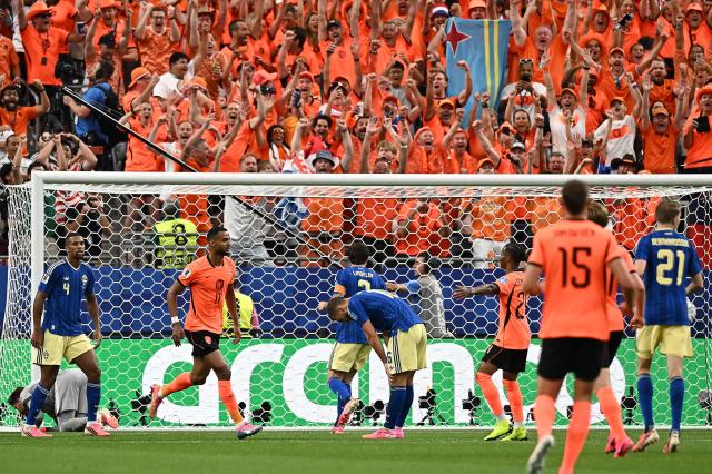 Netherlands' forward #11 Cody Gakpo (2nd L) celebrates after scoring his team's fourth goal during the 2026 World Cup Group F football match between the Netherlands and Sweden at the Houston Stadium in Houston on June 20, 2026.  (Photo by Paul ELLIS / AFP)