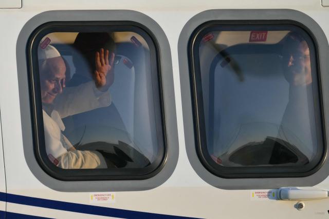 Pope Leo XIV waves from the helicopter at the end of a pastoral visit in Pavia and Sant'Angelo Lodigiano, on June 20, 2026. (Photo by Marco BERTORELLO / AFP)