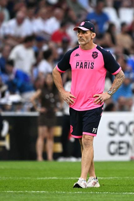 Stade Français' English head coach Paul Gustard walks on the pitch ahead of the French Top14 rugby union semi-final match between Montpellier Hérault Rugby and Stade Français at the Velodrome stadium in Marseille, southern France, on June 20, 2026. (Photo by Gabriel BOUYS / AFP)